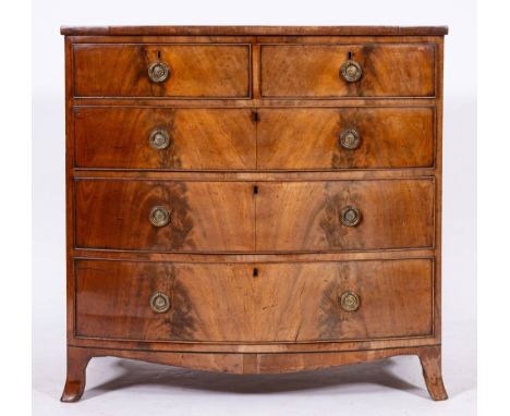  A George III mahogany bowfront chest of drawers, late 18th century,: the top with ebony stringing, the two short and three g