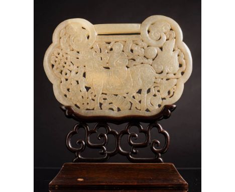 A large Chinese jade plaque in the form of a lock: carved and pierced to one side with a diety holding a lingzhi spray and ri