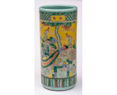 A Chinese yellow ground famille verte stick stand: painted with phoenix, flowering shrubs and rockwork below a pine tree, lat
