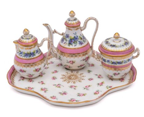 A Paris porcelain part tête a tête: comprising a quadrilobed tray, chocolate pot and cover, cream jug and cover, sucrier and 