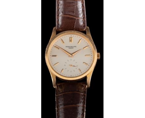 Patek Philippe, Calatrava, an 18 carat gold manual winding wristwatch,: the dial with baton markers, subsidiary seconds dial 