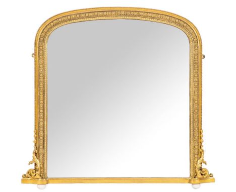 A Victorian giltwood and composition framed shallow arched overmantel mirror, last quarter 19th century,: the outer edge with