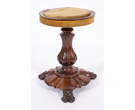 A William IV carved rosewood and upholstered piano stool, circa 1835,: the circular seat with moulded surround, the lobed and