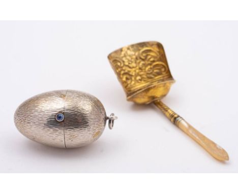 A continental silver cotton reel and needle holder, stamped marks in the form of an egg: the hinged lid enclosing a double sp