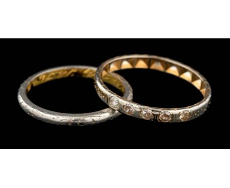 A diamond ring,: the band set with eight cut diamonds, ring size N 1/2; and a gold coloured band, stamped 18k, ring size K.