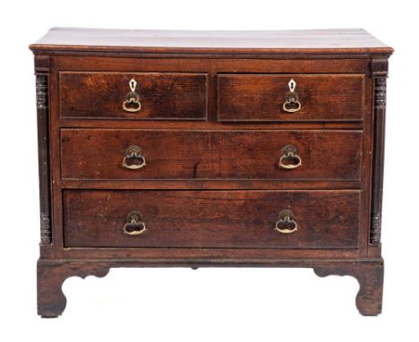 A George II oak chest of drawers,: mid 18th century, the top with moulded front and side edges, the two short and two long dr