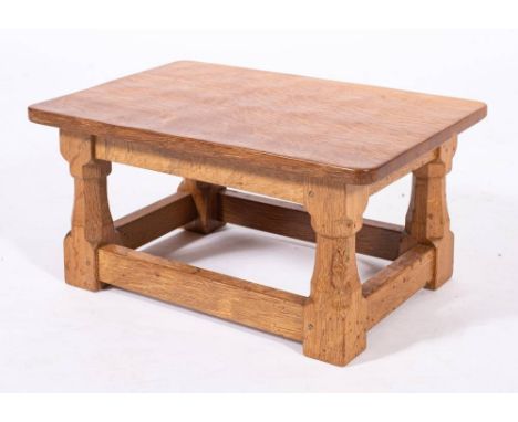 Workshop of Robert 'Mouseman' Thompson (Kilburn), an English oak low stool,: the rectangular top on four octagonal supports, 