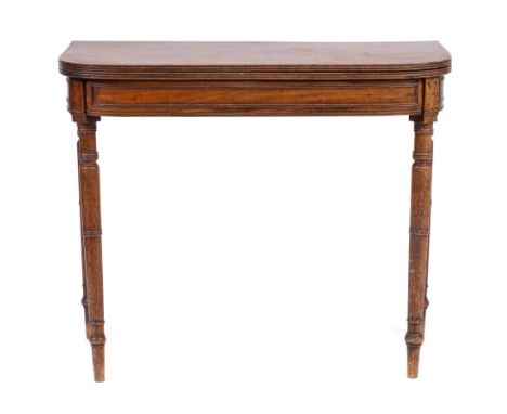 A Regency mahogany tea table, early 19th century,: the 'D' shaped hinged top with reeded edges, above panel friezes, on ring 