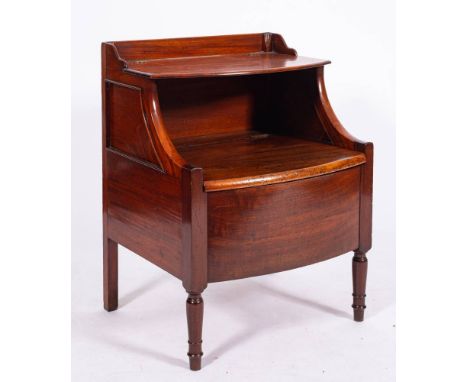 A George III mahogany bowfront commode, circa 1770,: with short three quarter gallery above an upper hinged half shelf, above