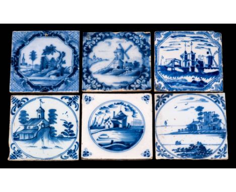 A group of six 18th century English blue and white delftware tiles: comprising ruined buildings with a tower in the backgroun