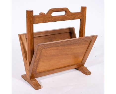 Workshop of Robert 'Mouseman' Thompson (Kilburn), an English oak newspaper and magazine rack,: the upper horizontal bar carve
