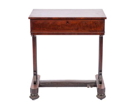 A George IV mahogany sewing table, circa 1825,: the hinged rectangular top opening to a fitted interior, above plain friezes;