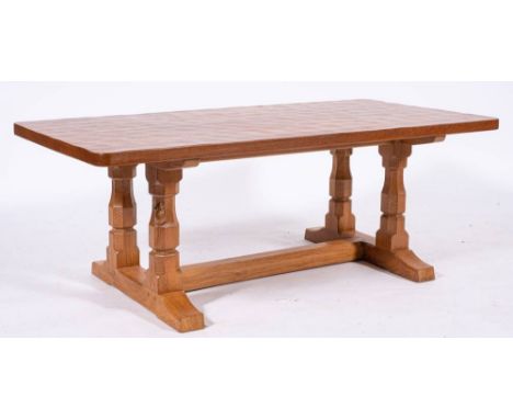 Workshop of Robert 'Mouseman' Thompson (Kilburn), an English oak coffee table,: the rectangular top on four supports to twin 