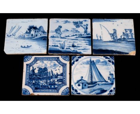 A group of five 18th century English blue and white delftware tiles: comprising a lady standing by a lake with a swimming swa