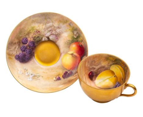 A Royal Worcester fruit painted cup and saucer: painted by William Ricketts with fruit and blossom on a mossy ground, signed,