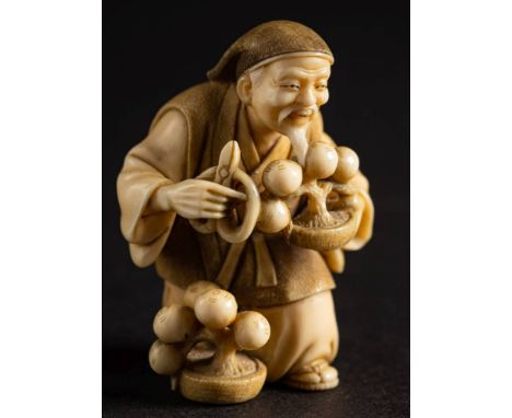 A Japanese carved ivory netsuke, signed Nanryu: of a man trimming a bonsai, a pair of shears in his right hand, Meiji, 5cm.