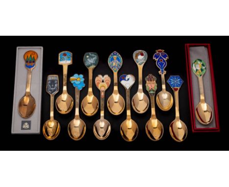 Thirteen Danish silver gilt and enamel Christmas spoons, by various makers including Falke Bang and Lars Bo for A. Michelsen: