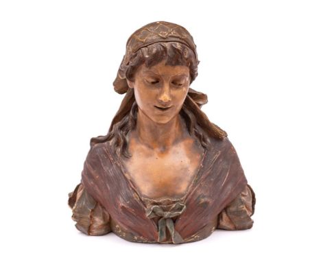 A Goldscheider terracotta bust: modelled as a young woman wearing a head scarf and ribbons under cold painted colours, impres