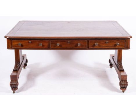 A Regency or George IV mahogany and leather inset library table, circa 1820,: the rectangular top with later gilt tooled brow