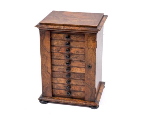 An Victorian burr walnut table top Wellington chest, circa 1860,: the caddy top with moulded edges, above ten drawers all wit