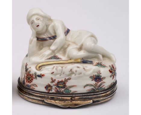 A St.Cloud silver-mounted snuff box and cover: in the form of a reclining shepherd, his head resting on his right hand, his d