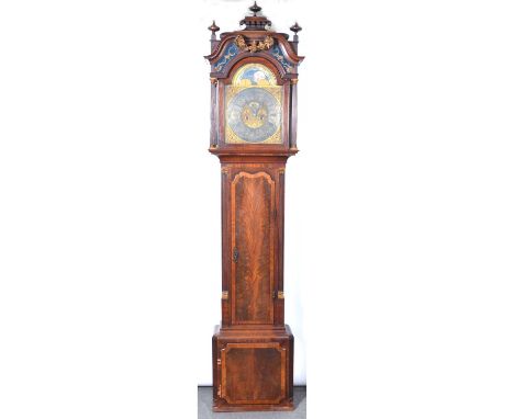 Mahogany longcase clock, the hood with pagoda top and three turned finials, swan-neck pediment joined by a gilt floral garlan
