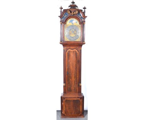 Mahogany longcase clock, the hood with pagoda top and three turned finials, swan-neck pediment joined by a gilt floral garlan