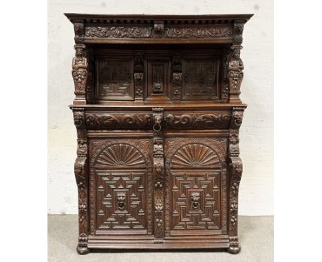 Anglo-Dutch carved oak court cupboard, late 17th or 18th century, cornice drawer with lion mask corbels and running scrolls, 