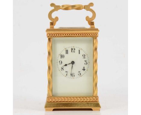 French gilt metal carriage clock, enamelled dial, with Arabic numerals, platform escapement, striking on a gong, the case wit