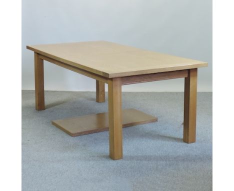 A modern light oak extending dining table, 250 x 100cm overall