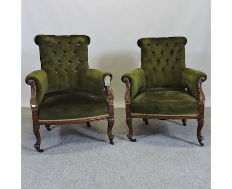 A pair of Victorian green upholstered button back armchairs