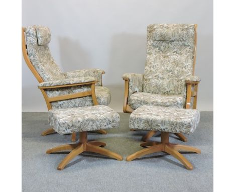 A pair of Ercol light elm reclining armchairs, together with matching footstools