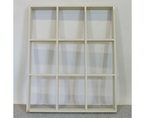 A cream painted hanging open wall shelf, 124cm