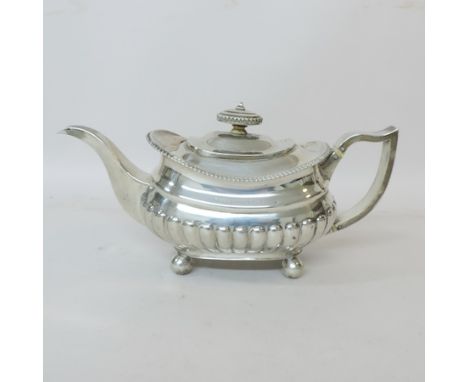 A George III silver teapot and cover, with gadrooned decoration, London 1813