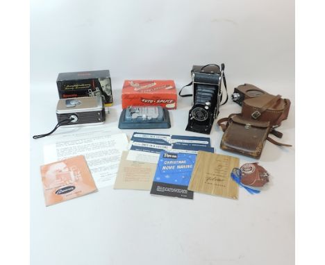 A collection of cameras, to include a Bell and Howell Filmo Sportster 8mm, with booklets, a Brownie 8mm movie camera, a Voigt