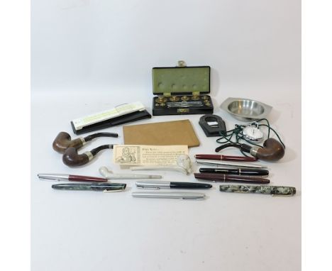 A collection of items to include a silver mounted pipe, by K & P Petersen, various other pipes, pens to include Parker founta