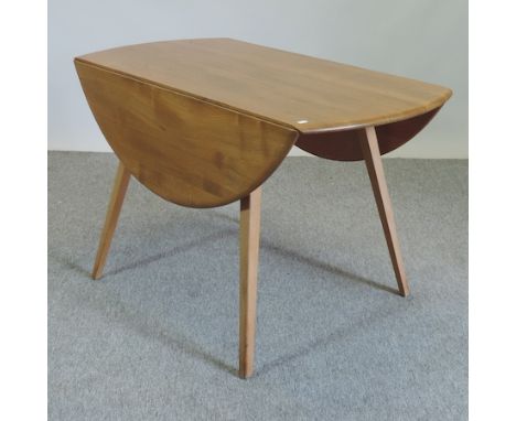 An Ercol light elm drop leaf dining table, 113cm