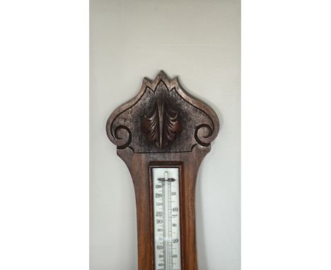 oak banjo-shaped wall barometer with porcelainised aneroid dial and mercury thermometer, weather indications “Stormy, Rain, 