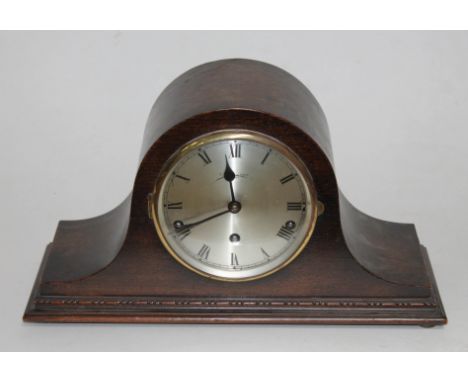 A domed oak cased striking mantel clock, length 41.5cm.  