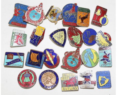 A collection of enamel Butlins badges.  