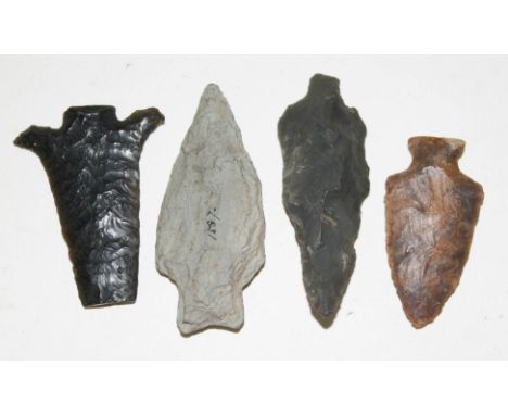 A group of four flint arrow heads, length 45mm to 65mm.  