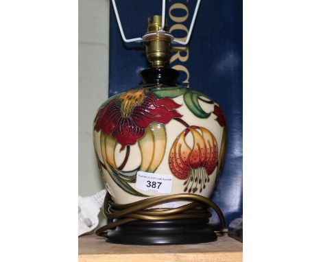 A Moorcroft pottery table lamp designed by Anna Lily, height 25cm.  