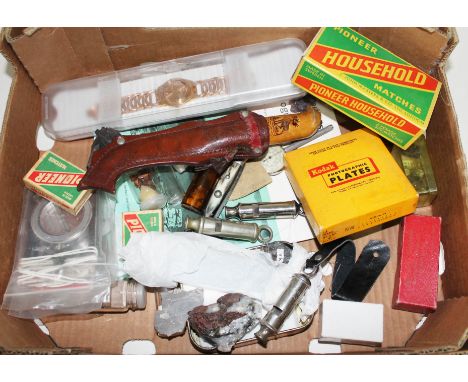 A box of assorted items including mineral samples, a Nordic knife, whistles, a Swatch watch etc.  