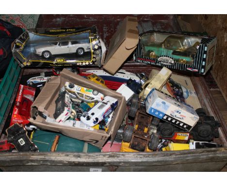A large tin trunk and contents comprising mainly die-cast model vehicles including Corgi, Vanguards etc. as found.  