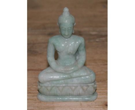 A carved jade buddha, height 11cm.Condition:- general wear through age, no sign of any damage or repair.Dimenesions:- 11cm hi