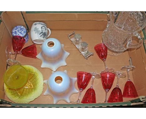 A box of assorted items including vaseline glass shades, a pressed glass dish, cranberry wine glasses, a twin handled cut gla