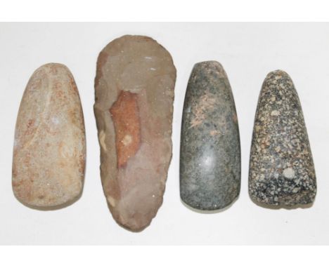 Three Mesolithic hand axes and a flint axe head, lengths  10cm to 14.5cm.  