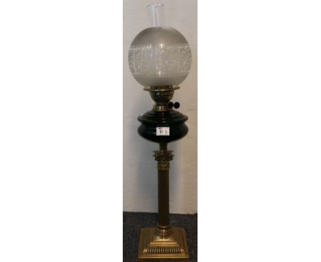 Early 20th Century glass double burner oil lamp with ceramic reservoir and brass corinthian column base, etched glass shade a