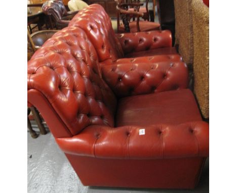 Pair of red leather button back Chesterfield style armchairs. (2)(B.P. 24% incl. VAT)