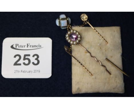 Victorian amethyst hair pin, citrine set cloak clasp and a stick pin.(B.P. 24% incl. VAT)